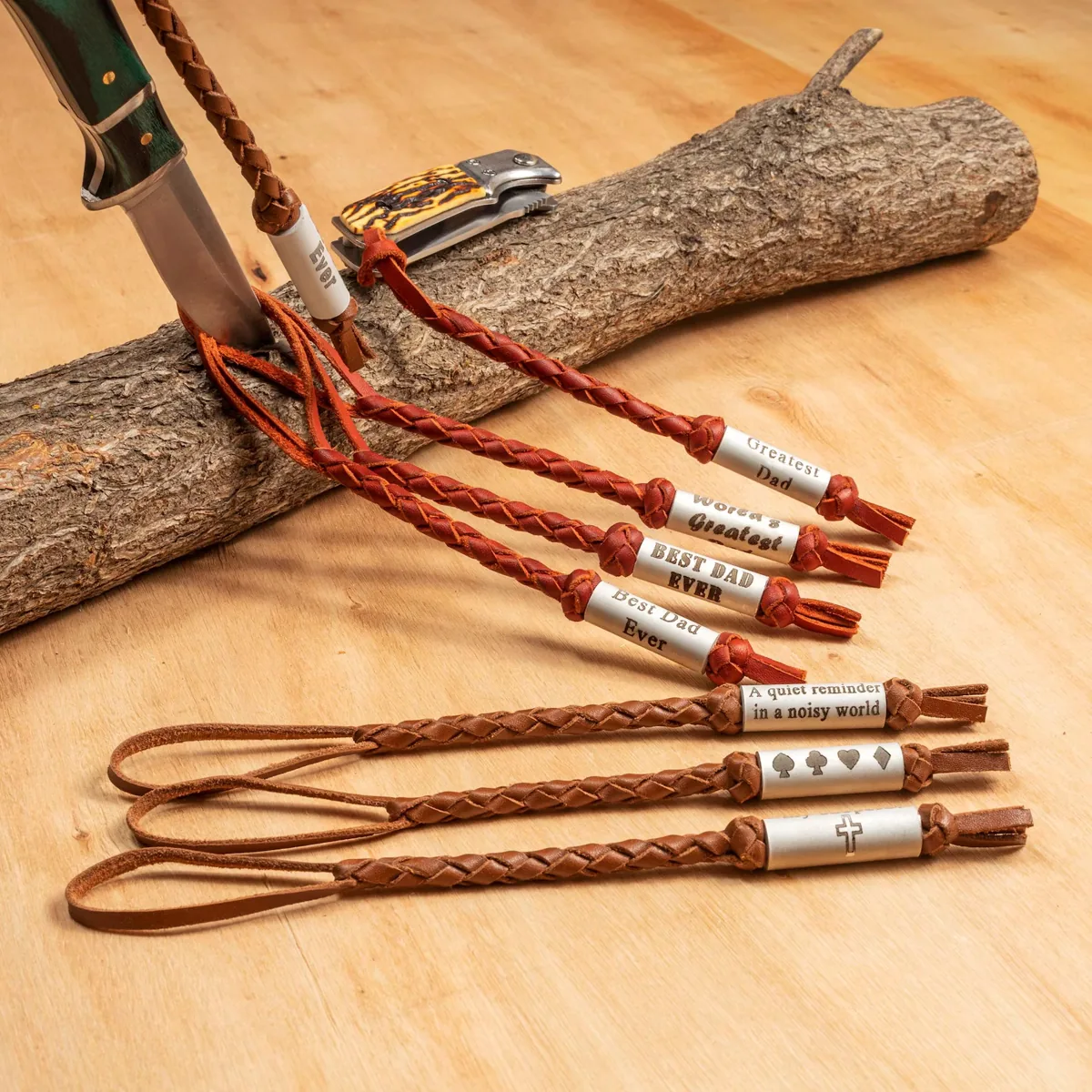 Braided leather knife lanyards with personalized engraved beads showing names and gift messages